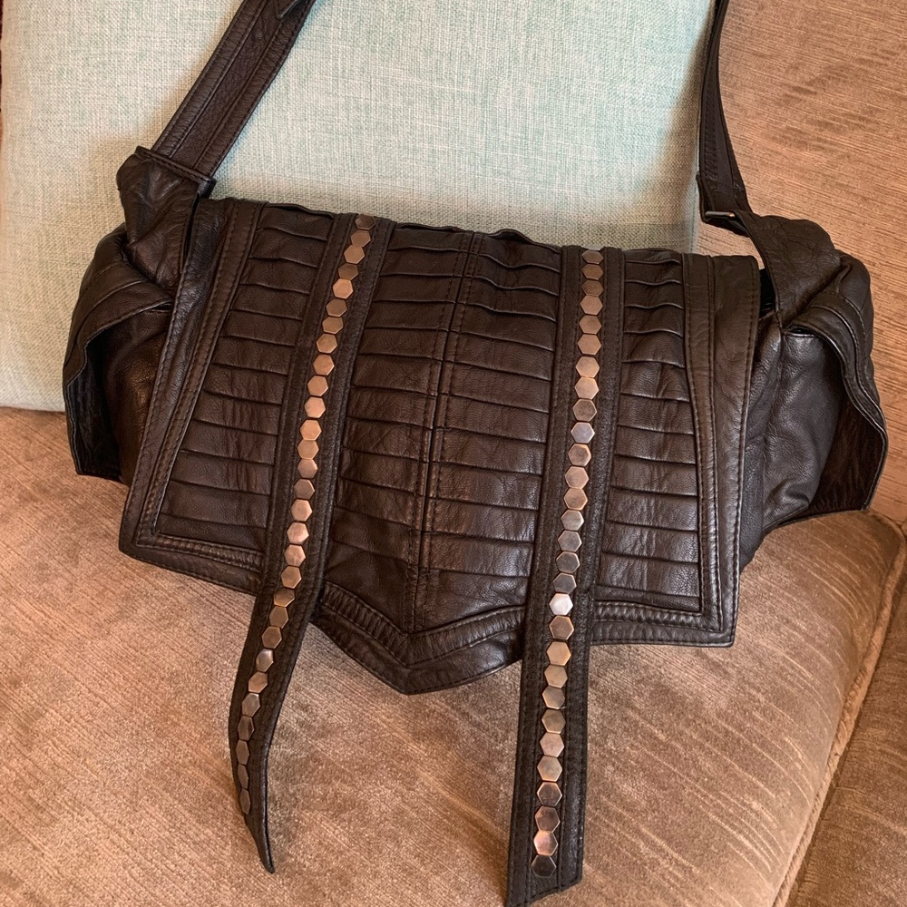 Black leather goth style purse in lamb skin with metal hexagon studs.